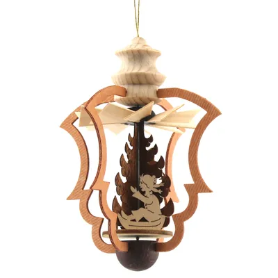 A wooden Christmas pyramid ornament with a winter child motif.