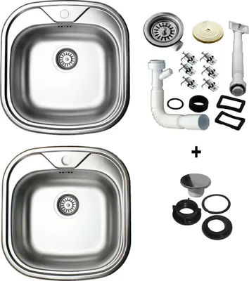 A top-down view of two stainless steel kitchen sinks and various plumbing accessories.