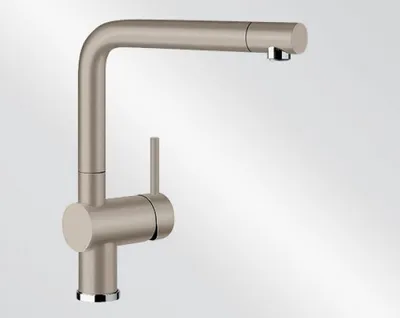 A studio shot of a kitchen faucet against a plain background.