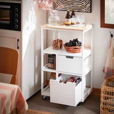 A kitchen cart filled with food items and drinks, placed in a kitchen setting.
