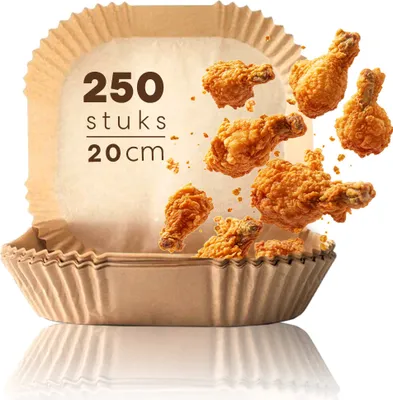 Fried chicken drumsticks are shown falling into a brown paper liner.