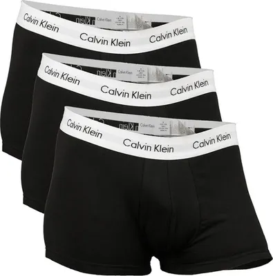 Three black Calvin Klein boxer briefs are stacked on top of each other.