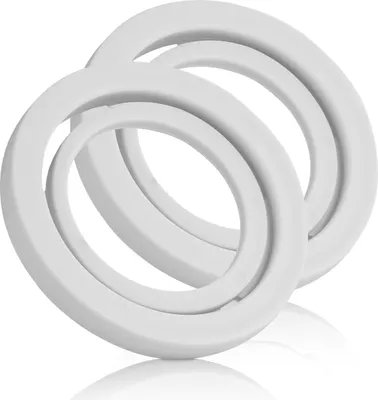 Two white rings are stacked on a white surface, with a reflection underneath.