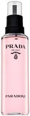 A product shot of a pink perfume bottle with a black cap and silver spray nozzle.