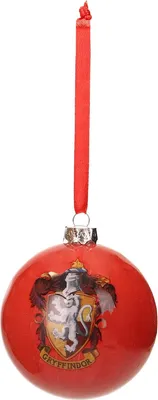 A red Christmas ornament with the Gryffindor crest from Harry Potter.