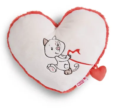 A heart-shaped pillow with a cat illustration.