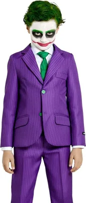 A child dressed as the Joker, wearing a purple pinstripe suit and green tie, with face paint.