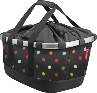 A black bicycle basket with colorful polka dots and a drawstring closure.