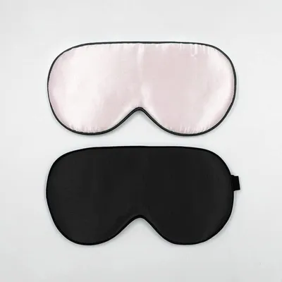 Produktbild von 2 Schlafmasken aus 100% Seide mit verstellbaren Bändern, bequem und superweich, 1 schwarz und 1 rosa.