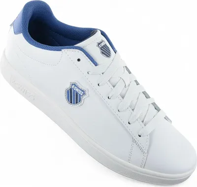 A white K-Swiss sneaker with blue accents is shown against a white background.