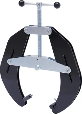 A black pipe alignment clamp with silver adjustment mechanisms is shown against a white background.