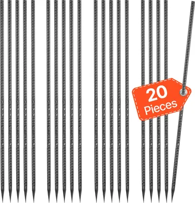 A collection of metal ground stakes arranged vertically against a white background.