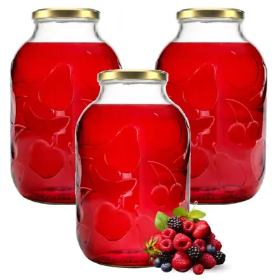 Three glass jars filled with red liquid, with a pile of berries in the foreground.