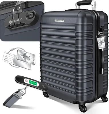 A dark gray KESSER suitcase with accessories like a luggage scale and tags.