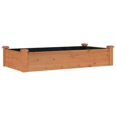 A wooden raised garden bed on a white background.