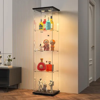 A tall, multi-shelf glass display cabinet filled with various items, including bottles, figurines, and decorative objects, is shown in a room setting.