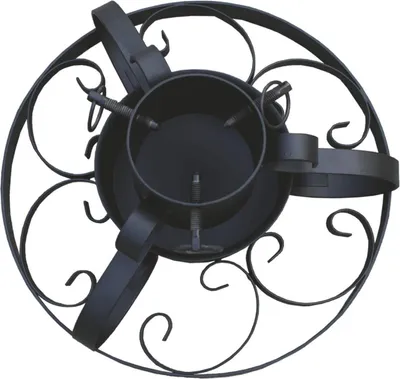 A black metal Christmas tree stand with decorative scrollwork.