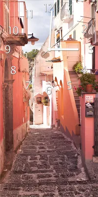 Produktbild von Wallario Design Wanduhr Südländische Gasse- Italien bei Sonnenschein aus Echtglas, Größe 30 x 60 cm