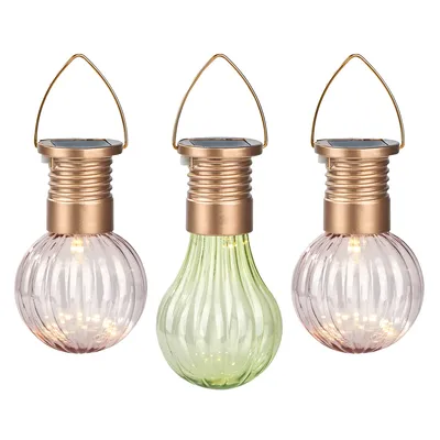 Three solar-powered lanterns shaped like lightbulbs, two pink and one green, with gold-colored tops and handles, displayed against a white background.