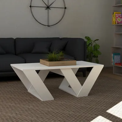 A modern living room scene with a couch, coffee table, and clock.