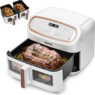 A white air fryer with a large steak and vegetables inside the cooking basket, and two smaller baskets with food shown in the upper left corner.