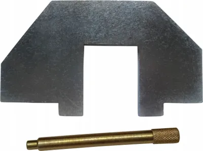 A metal tool and a brass pin are shown against a white background.