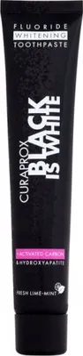 A black tube of Curaprox Black Is White toothpaste is shown against a white background.