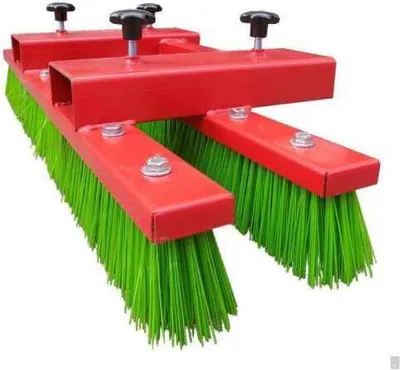 A red and green industrial broom attachment for a forklift, shown against a white background.