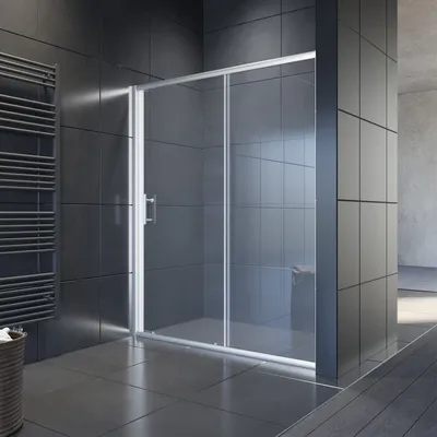 A modern bathroom with a glass shower enclosure.