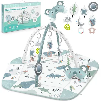 A product shot of a baby play mat and its packaging, with various accessories displayed.