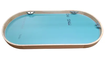 An oval mirror with a wooden frame and a blue backing, shown from a slightly elevated angle.
