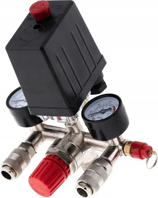 A close-up studio shot of an air compressor pressure switch with two pressure gauges and multiple connectors.