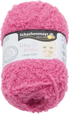 A ball of pink yarn with a label showing the brand and product name.