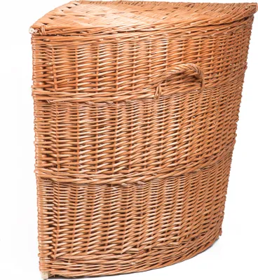 A wicker laundry basket designed for a corner.