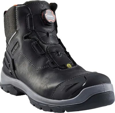 A black work boot with gray accents and an orange dial for tightening.