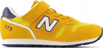 A side view of a yellow New Balance sneaker for children.