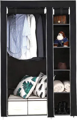 A black fabric wardrobe with clothes hanging on a bar and items stored on shelves.