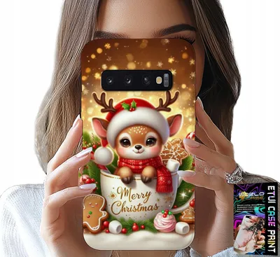 A person is holding a phone case with a Christmas-themed design featuring a cute reindeer in a mug.