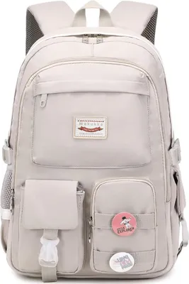 A front view of a light gray backpack with multiple pockets and decorative pins.