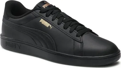 A black Puma sneaker with gold accents.