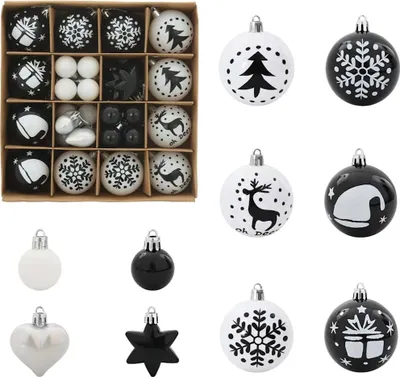 A collection of black and white Christmas ornaments, some in a box and some displayed individually.