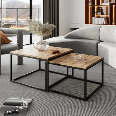 A modern living room scene with two nesting coffee tables.