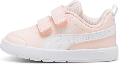 A side view of a pink Puma sneaker for children.