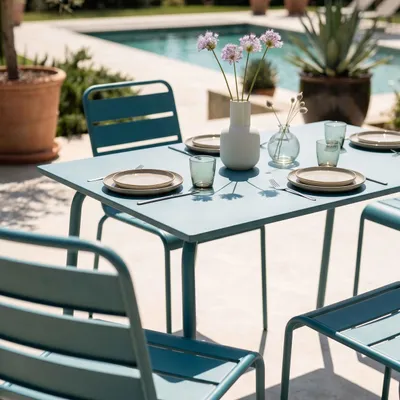 Image de Ensemble table de jardin en métal et 4 chaises bleu pacific - Oviala Palavas