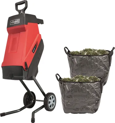 A red and black garden shredder with two collection bags filled with shredded material, set against a white background.