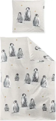 A flat lay of a duvet cover and pillowcase set with a penguin print.