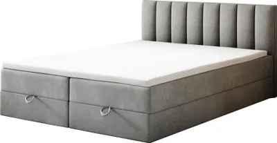 A gray upholstered bed with a white mattress and two drawers on the front.