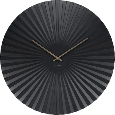 A black wall clock with a sunburst pattern.