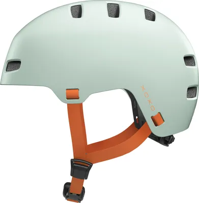 A mint green city helmet with orange straps is shown against a white background.