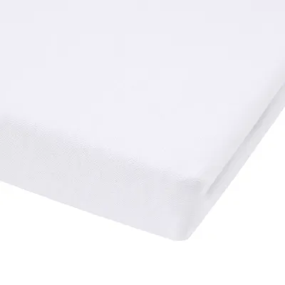 A close-up view of a white fitted sheet, folded to show its texture and thickness.